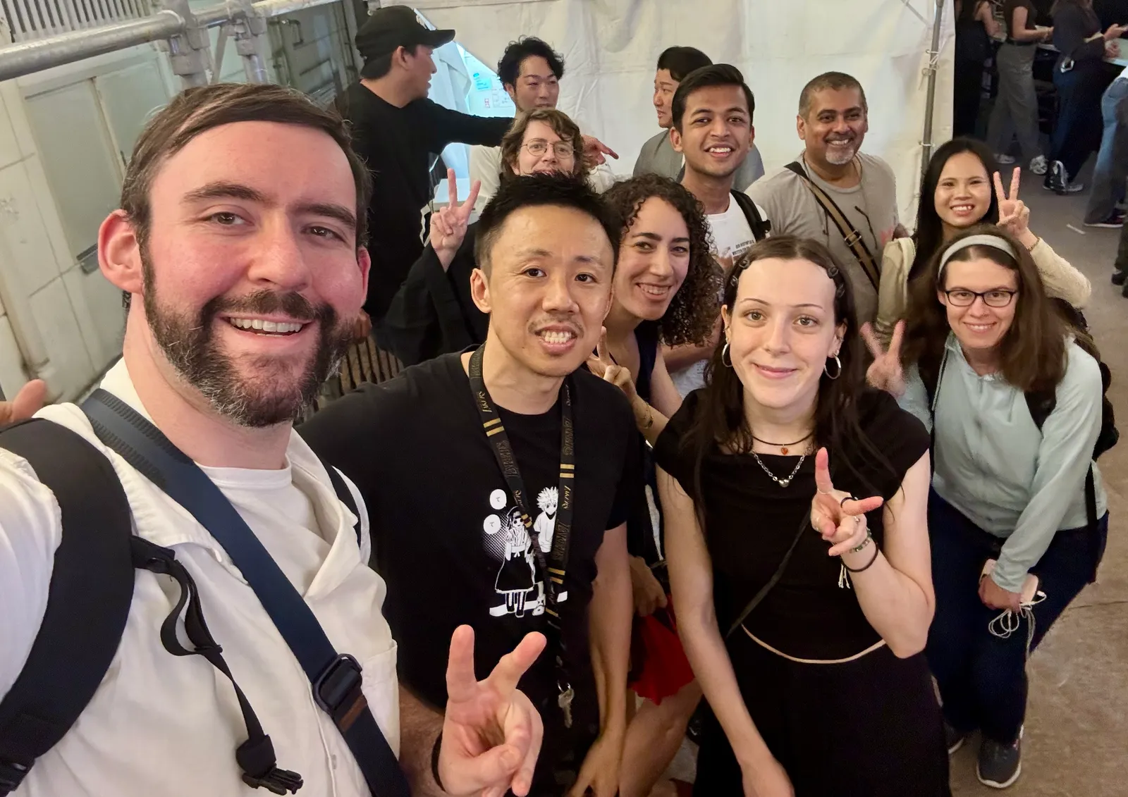 A big group selfie at an event in Nakasu-Kawabata