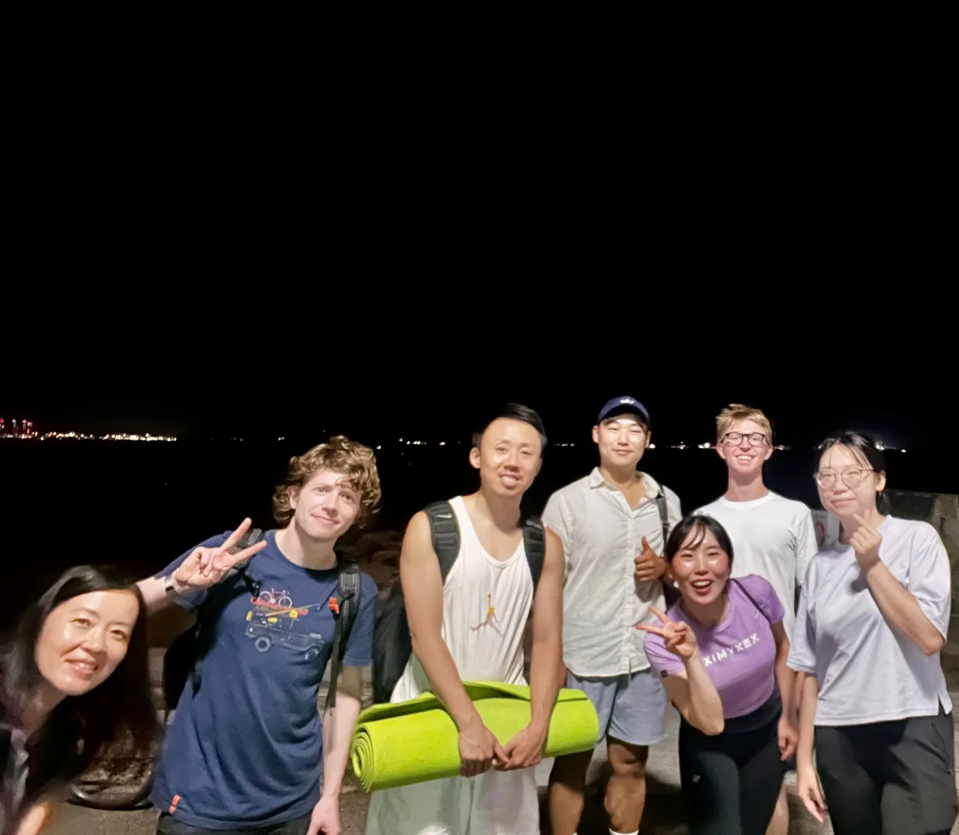 Members by the bay after an evening yoga session